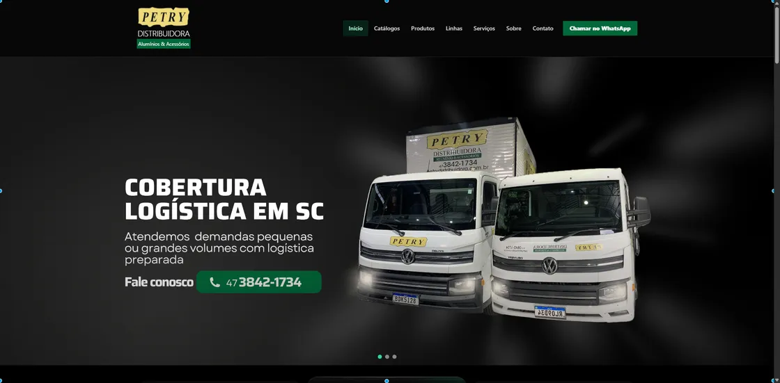 Screenshot of the Petry Distribuidora website homepage, showing two branded delivery trucks and a "Logistics Coverage in SC" hero section.